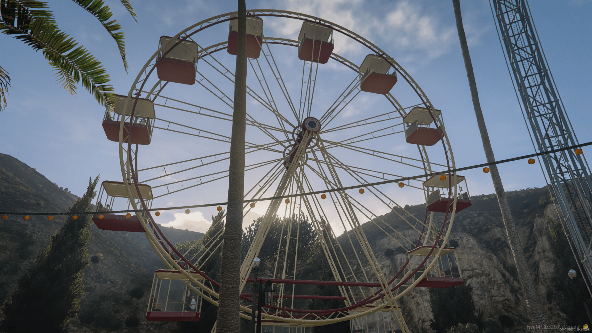 The Ferris wheel against the hills