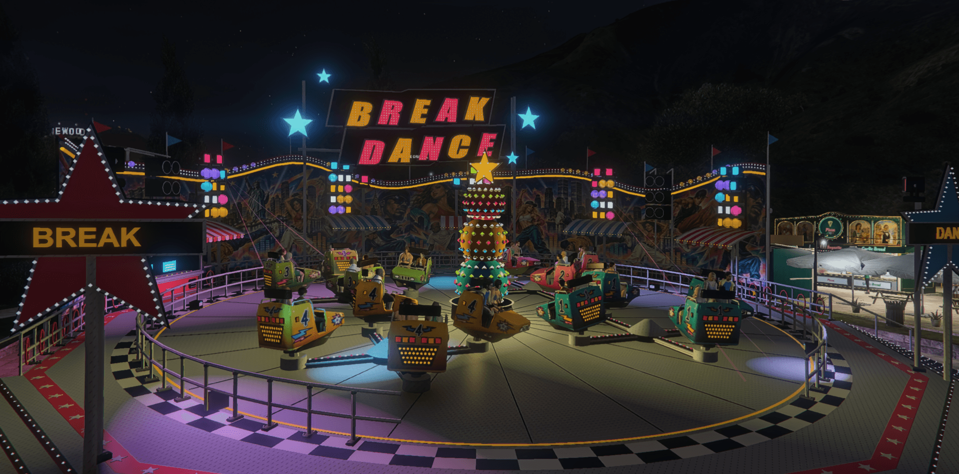 The Breakdance ride lit up at night